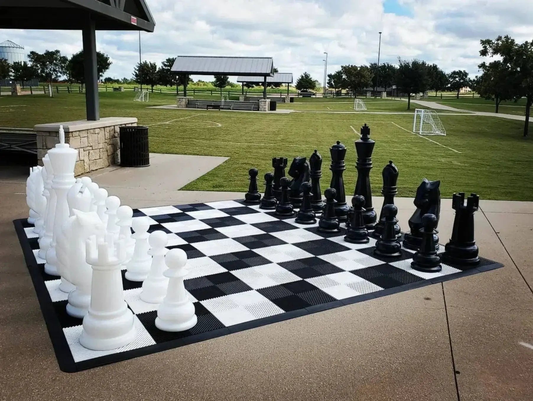 What Is the Best Outdoor Chess Set Material? Large outdoor chess set on a park chessboard.