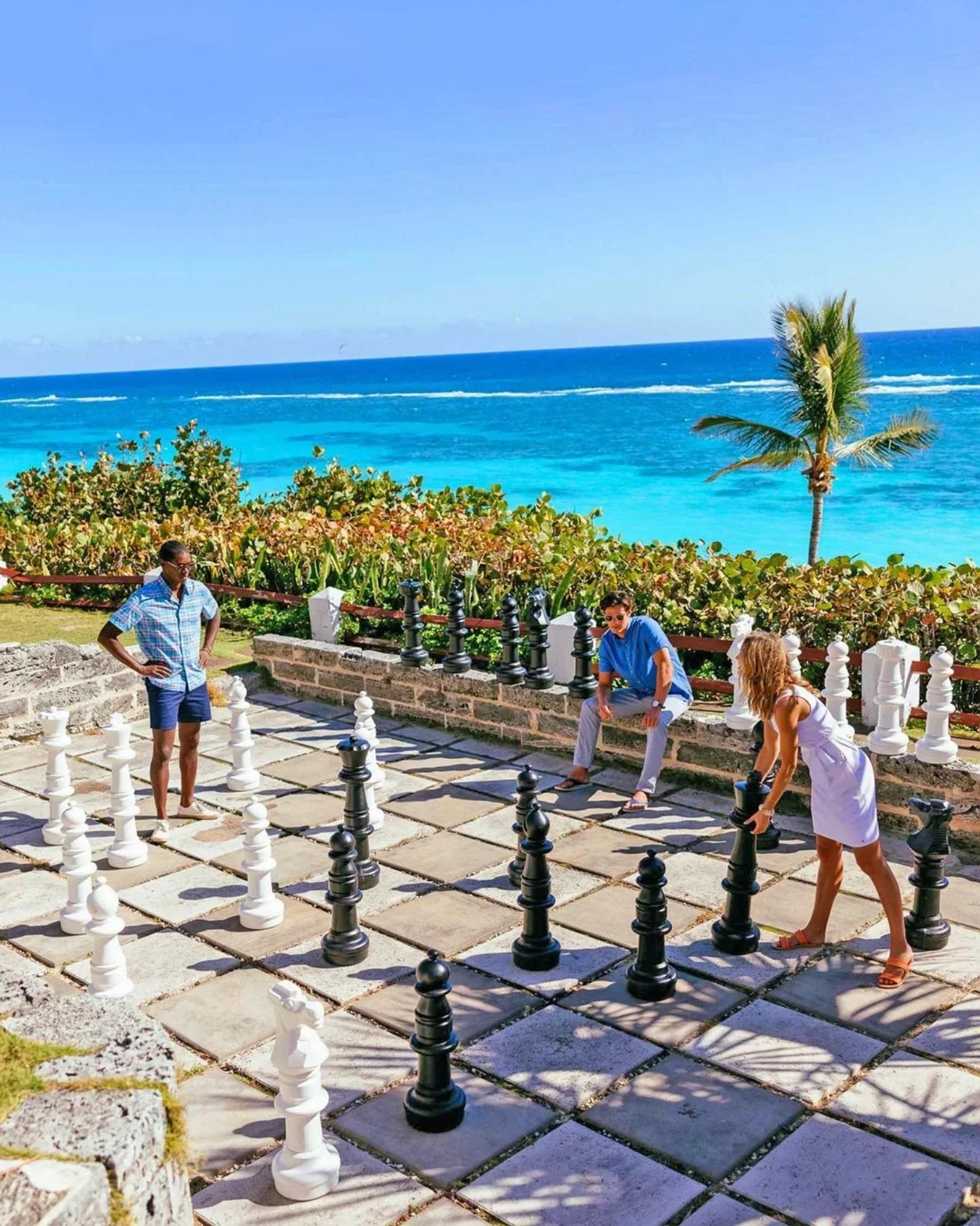 photo-unique-experiences-to-boost-resort-sales-with-guests-playing-giant-chess-overlooking-ocean-at-resort