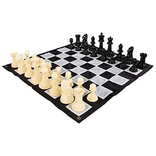 8 Inch Plastic Giant Chess Sets on a black and white checkered board with classic pieces.