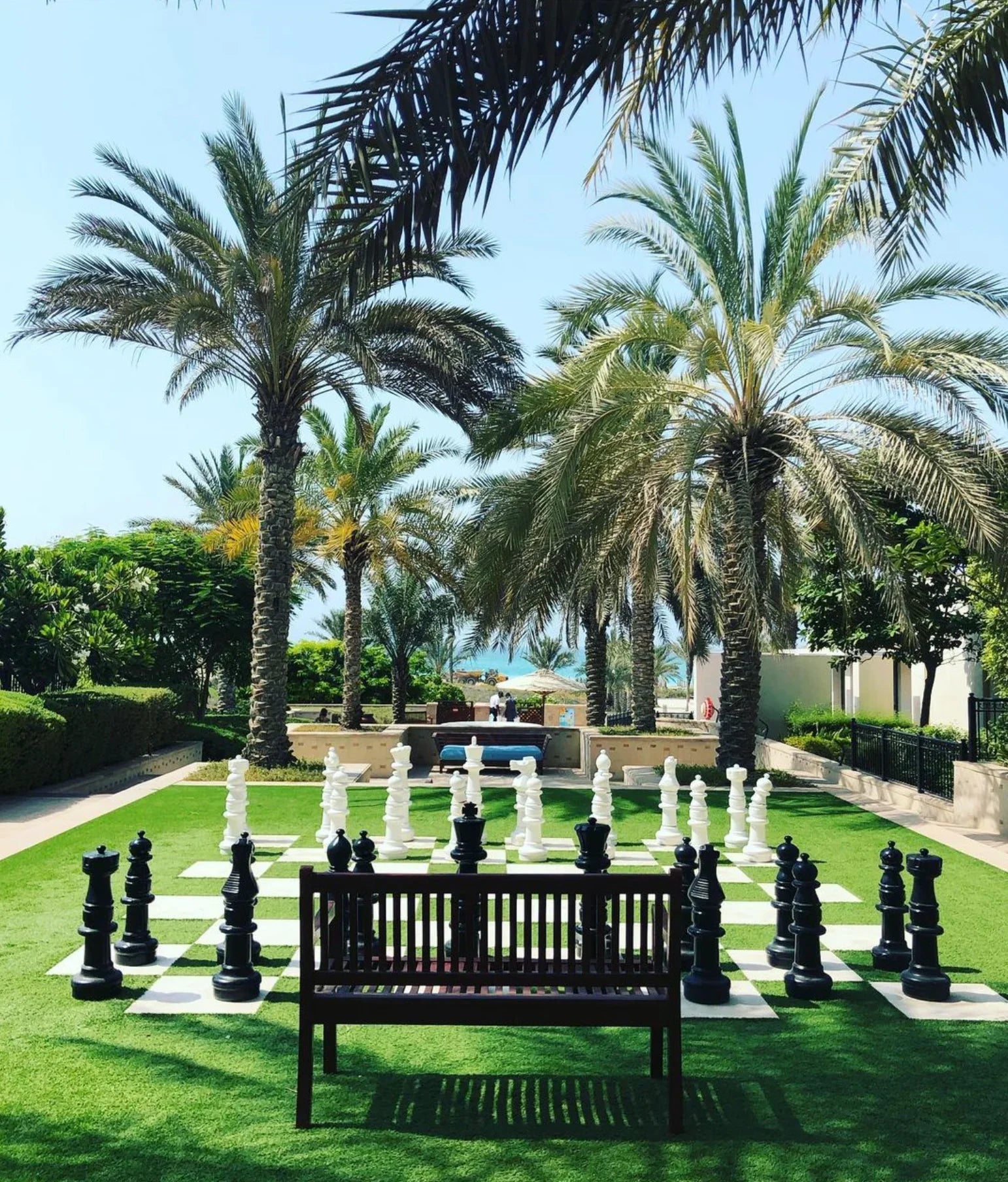 giant chess board at tropical resort courtyard hotel with giant chess board and palm trees