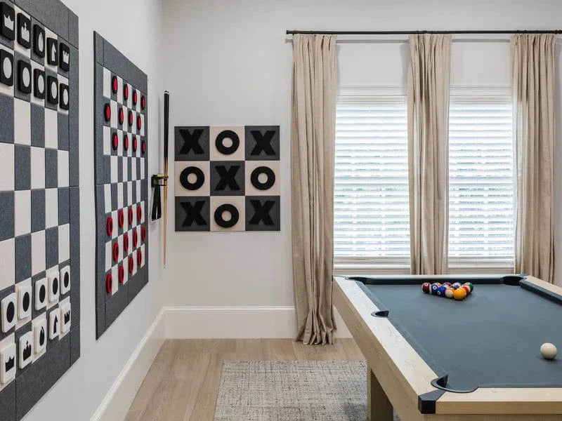 Giant Wall Games featuring stylish wall chess, checkers, and tic-tac-toe decor in a game room.